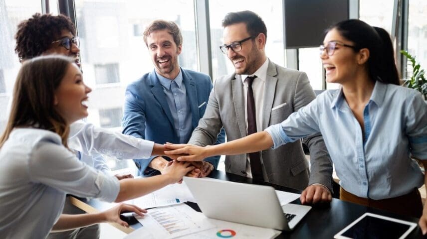 Business team celebrating a good job in the office