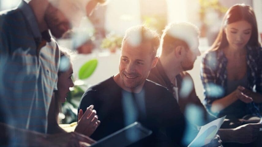 Business people in office connected on internet network with a tablet. concept of startup company. double exposure