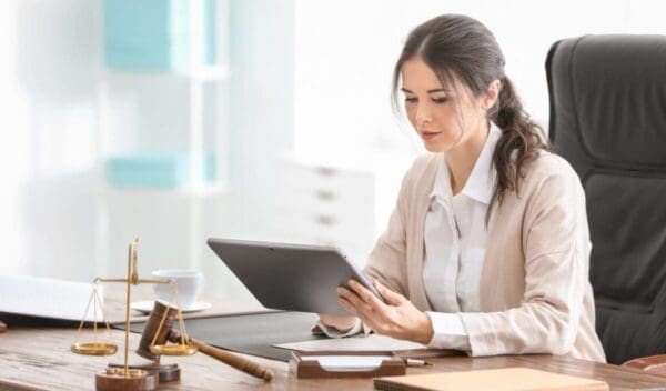 Young female notary working in office