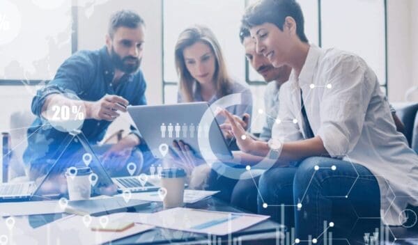 Concept of digital diagram,graph interfaces,virtual screen,connections icon on blurred background.Coworking team at business meeting.Group of colleagues working with startup project in modern office