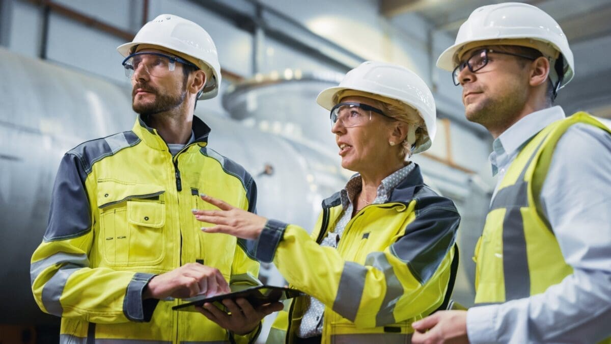 Digital Transformation in Manufacturing, Workers using technology in manufacturing plant