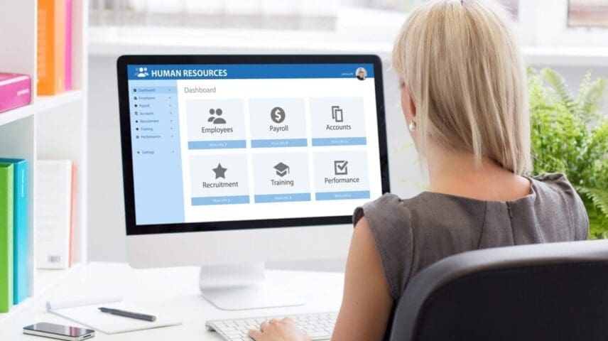 Woman working with human resources software at work