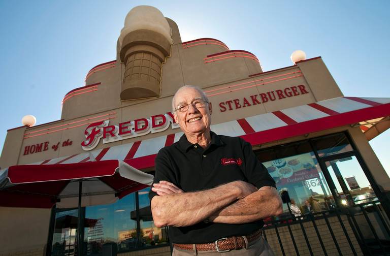 Freddy's owner in front of building
