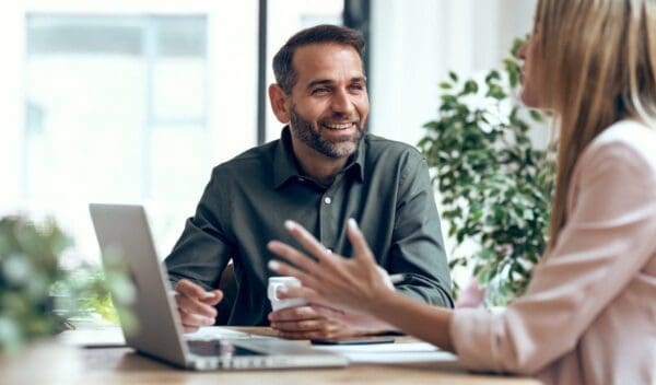 Shot of people working together with laptop on digital transformation services