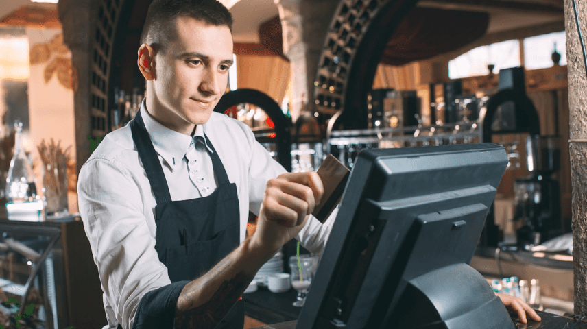 Waiter using POS System in Restaurant - How to Source the Best POS for Your Business