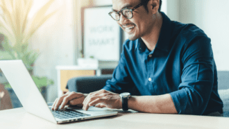 person on laptop to visually communicate the idea of someone writing an RFP