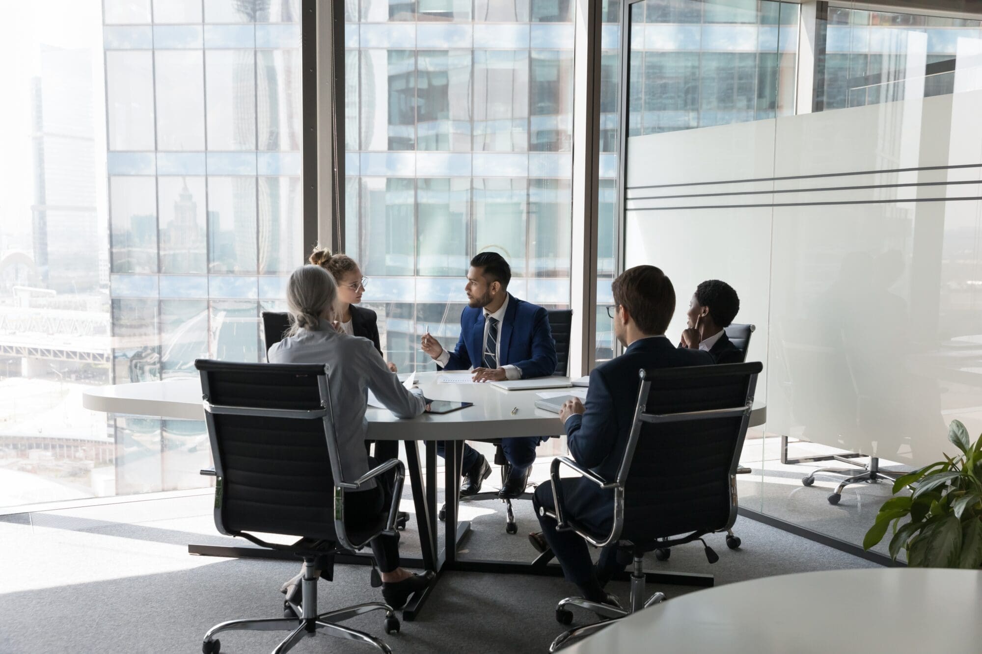 People evaluating agentic AI platforms in a board room